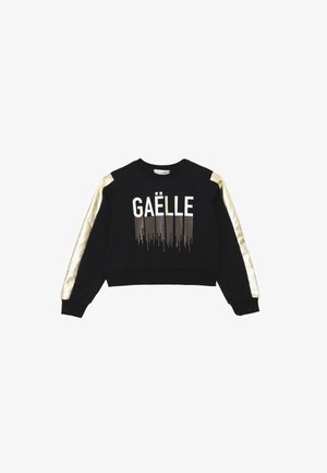 Felpa nera con maniche in raso dorato, con la scritta "GAËLLE" in bianco e dettagli in strass per un design texture. Vestibilità cropped.