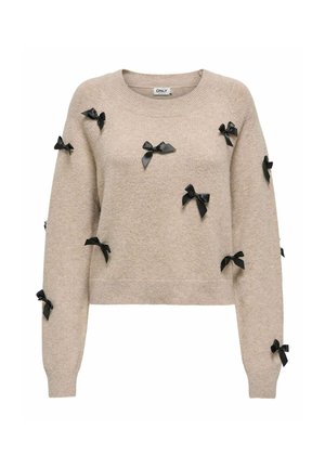 Pull en maille beige à manches longues, décoré de multiples petits nœuds en satin noir dispersés sur le devant et les manches.