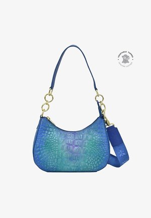 Crocodile-patterned leather handbag in gradient blue and green, featuring a curved shape, gold hardware, and two detachable straps.