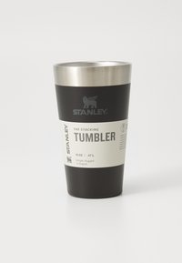 Black stainless steel tumbler with a silver rim. Features a label with text, logo, and a 16 oz (0.47 L) capacity indication.