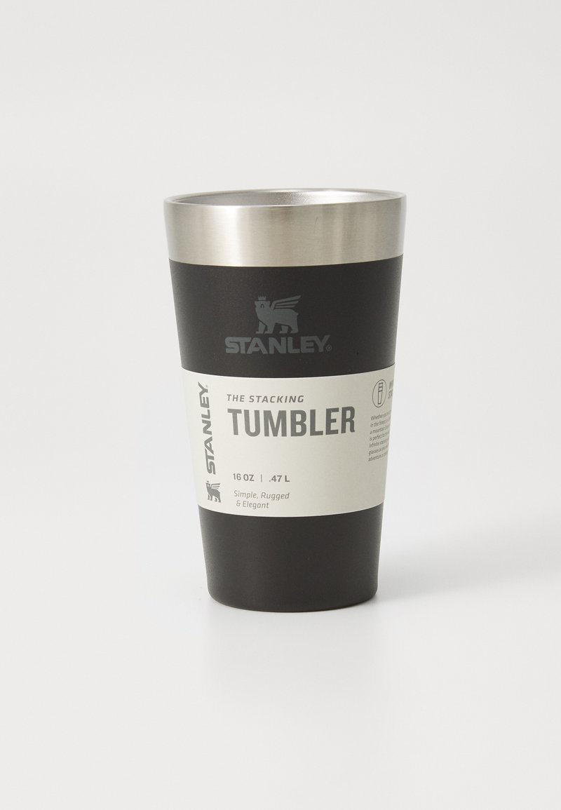 Black stainless steel tumbler with a silver rim. Features a label with text, logo, and a 16 oz (0.47 L) capacity indication.