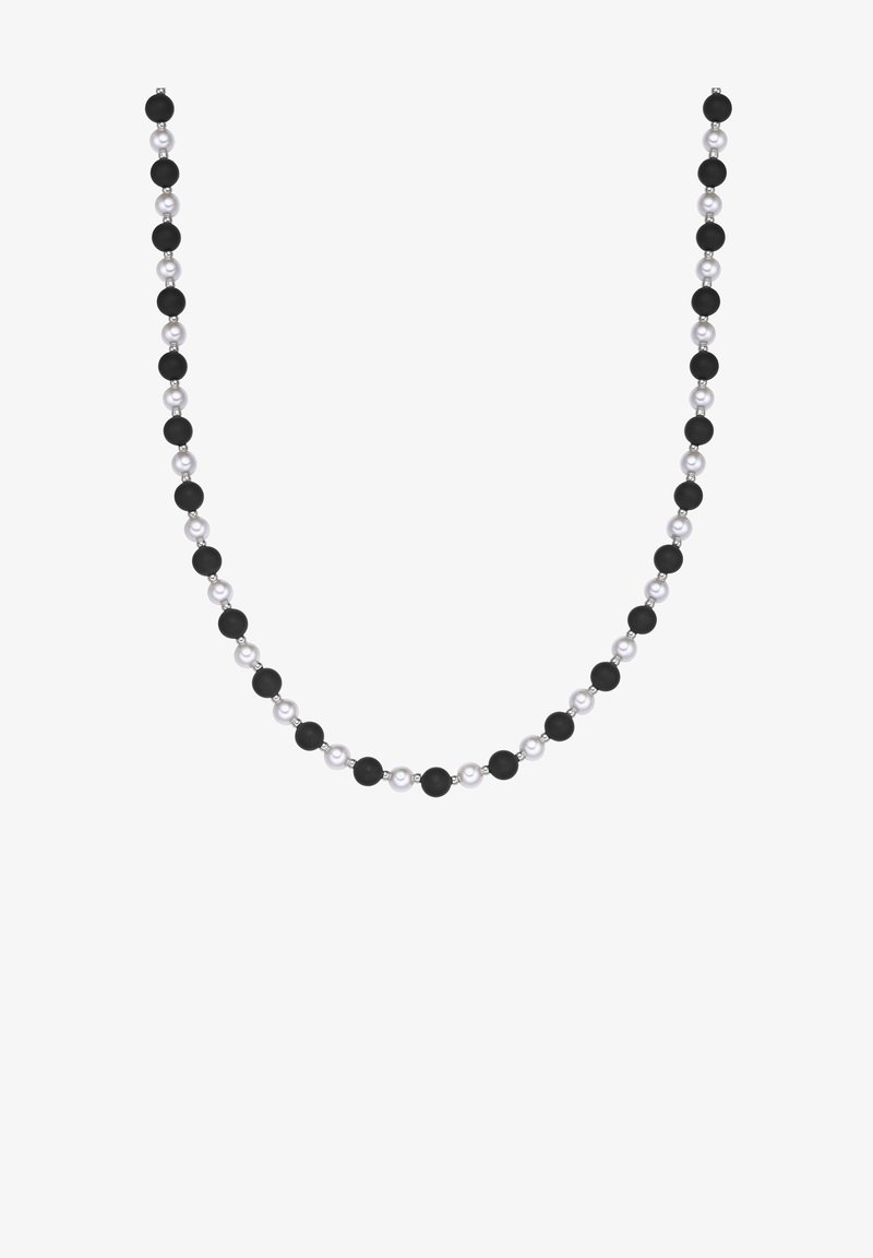 Zwart-witte kraalcollier met afwisselend matte zwarte en glanzende witte kralen, gerangschikt in een symmetrisch patroon.
