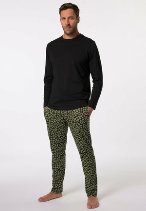 Black long-sleeve shirt paired with green patterned pants featuring leaf-like designs. The ensemble is cotton with a relaxed fit.