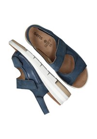 Blauwe open teen sandalen met verstelbare banden en witte zolen, maat 38, met gewatteerde beige voetbedden en getextureerde zijpanelen.