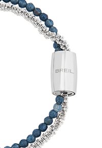 Silver bracelet featuring blue semi-precious beads arranged with a spiral metal chain; a sleek, engraved silver clasp labeled "BREIL."