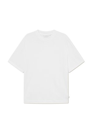White short-sleeve t-shirt made of soft cotton. Features a round neckline, relaxed fit, and side tag detailing. Smooth texture.