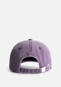 Purple cotton baseball cap with a flat brim, adjustable strap, and stitched details. Soft texture and low-profile design.