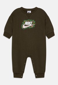 Olive green toddler jumpsuit made of soft fabric, featuring a large multicolored Nike logo on the front and snap fasteners along the bottom.