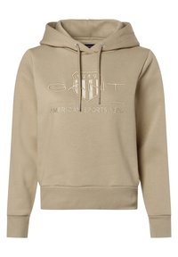 Sudadera con capucha beige, con puños y dobladillo de canalé, que presenta un logo 'GANT' bordado y un diseño de escudo, fabricada en una suave mezcla de algodón.