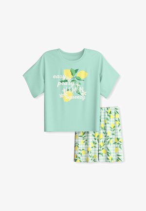 Chemise à manches courtes vert menthe avec graphique de citron jaune et texte « easy peasy lemon squeezy », assortie à un short imprimé citron.