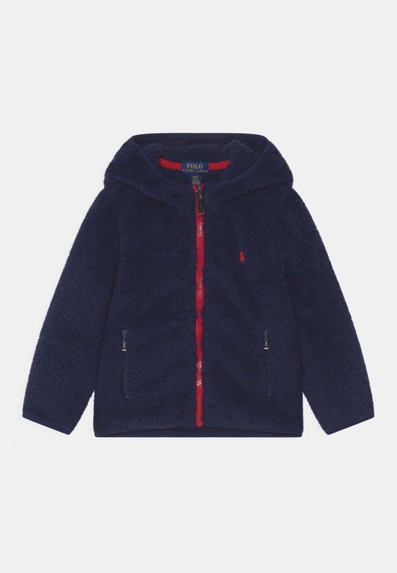 Navy fleece jacket with a hood, red zipper, and side pockets. Features soft texture and small logo detail on the chest.