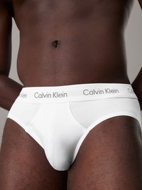 Slip di cotone bianco con elastico in vita con logo Calvin Klein, dalla texture liscia e dal design aderente.
