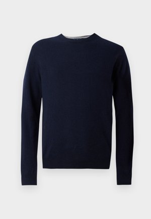 Mørkeblå strikket genser med rund hals, lange ermer og ribbestrikkede mansjetter og nederkant. Laget av myk stoff med en glatt tekstur.