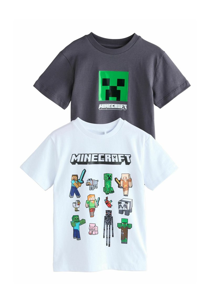 Deux t-shirts à manches courtes. Un gris avec un graphisme de Creeper Minecraft vert ; l'autre blanc présentant divers personnages pixélisés de Minecraft.