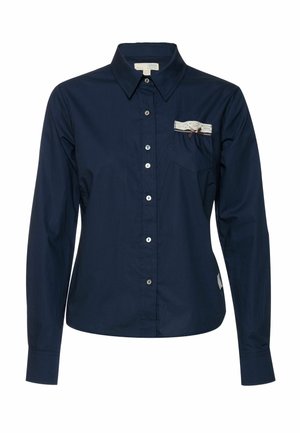 Marineblauw, lange mouwen, overhemd met knopen en kraag, enkele borstzak met kanten rand en een decoratieve strik. Gladde textuur.