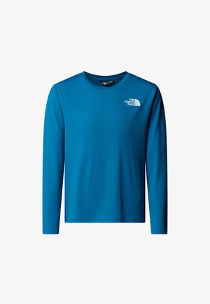 Hosszú ujjú ing élénk kék anyagból. Kerek nyakkivágással és egy kis fehér logóval az alsó bal mellrészen. Sima textúra.