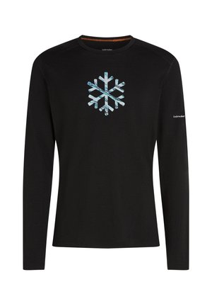 Svart långärmad skjorta i mjukt material, med ett ljusblått snöflinge-motiv på framsidan och en logotyp på ärmen.