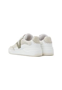 White sneakers with beige suede accents and a textured white rubber sole. Features a prominent stitched design along the heel and sides.
