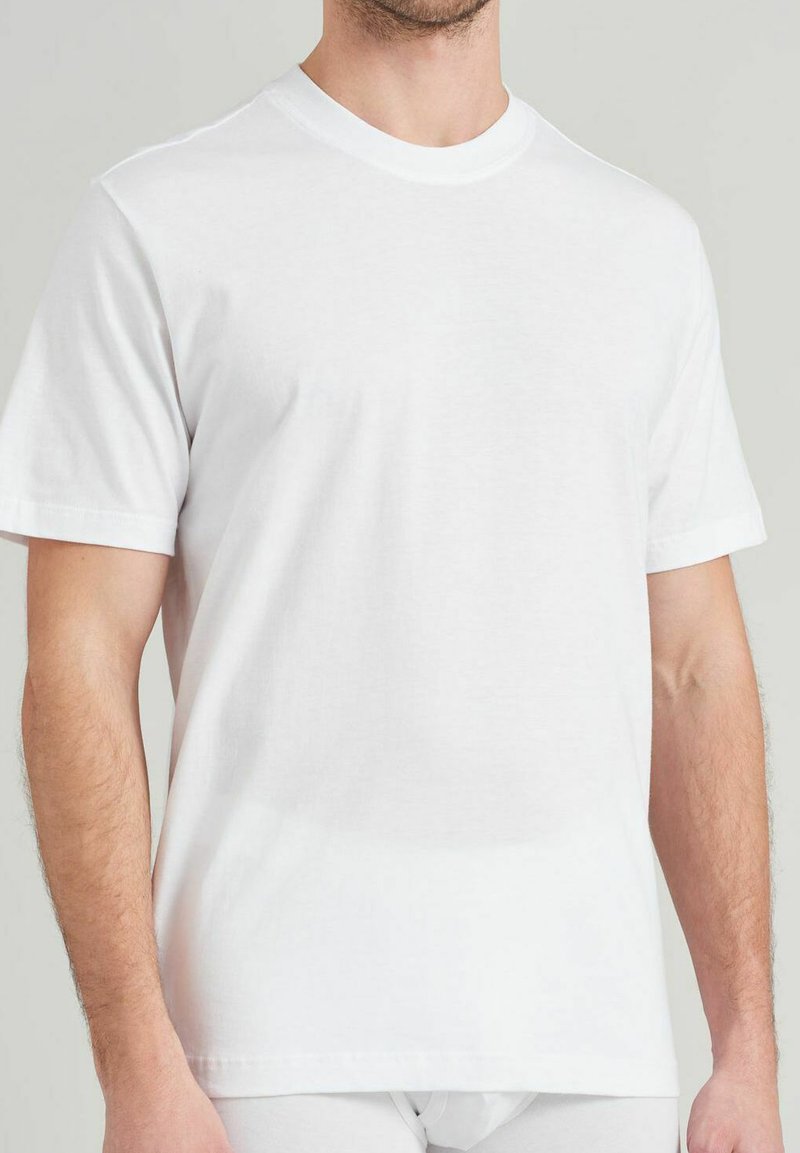 White cotton t-shirt with short sleeves, crew neck, and a smooth texture. Simple design, no visible patterns or markings.