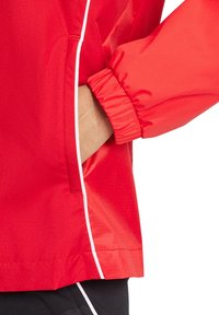 adidas Performance ALLWETTER TIRO COMPETITION - Regenjas - rotlila
