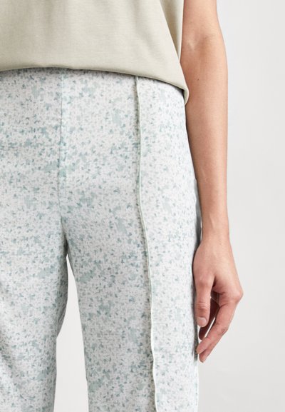 Lichtgroene pyjamabroeken met een gestructureerd, gespikkeld patroon, met een contrasterende zijstreep en een relaxte pasvorm. Zachtheid en ademend materiaal.