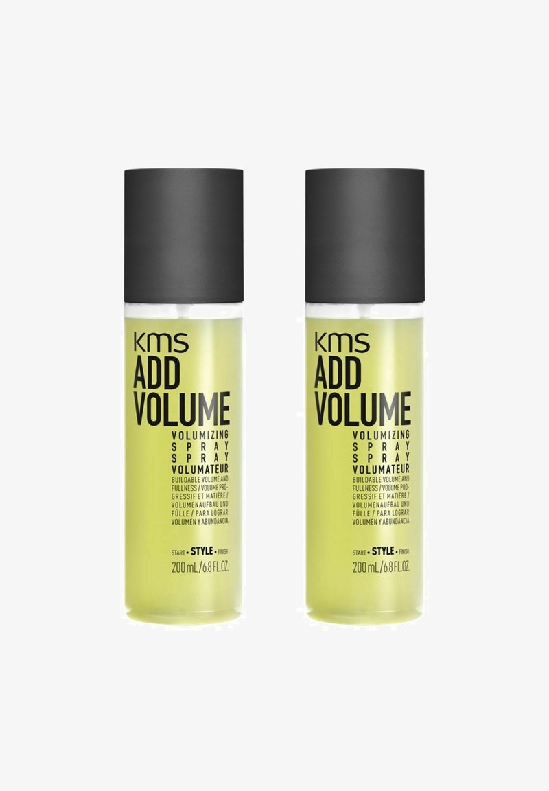 KMS Add Volume volumizing spray in two transparent bottles, each with a black cap; bright yellow liquid; labeled 200ml/6.8fl oz.