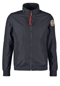 Mörkblå zip-up jacka av slät tyg, med ståkrage, ribbade ärmslut och en logotypapplikation på vänster ärm.