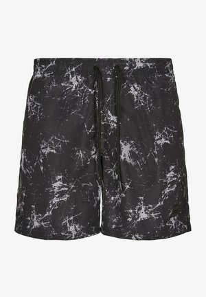 Férfi fürdőshorts, fekete alapon fehér foltformával, gumis derékkal és állítható zsinórral. Könnyű anyagból készült.