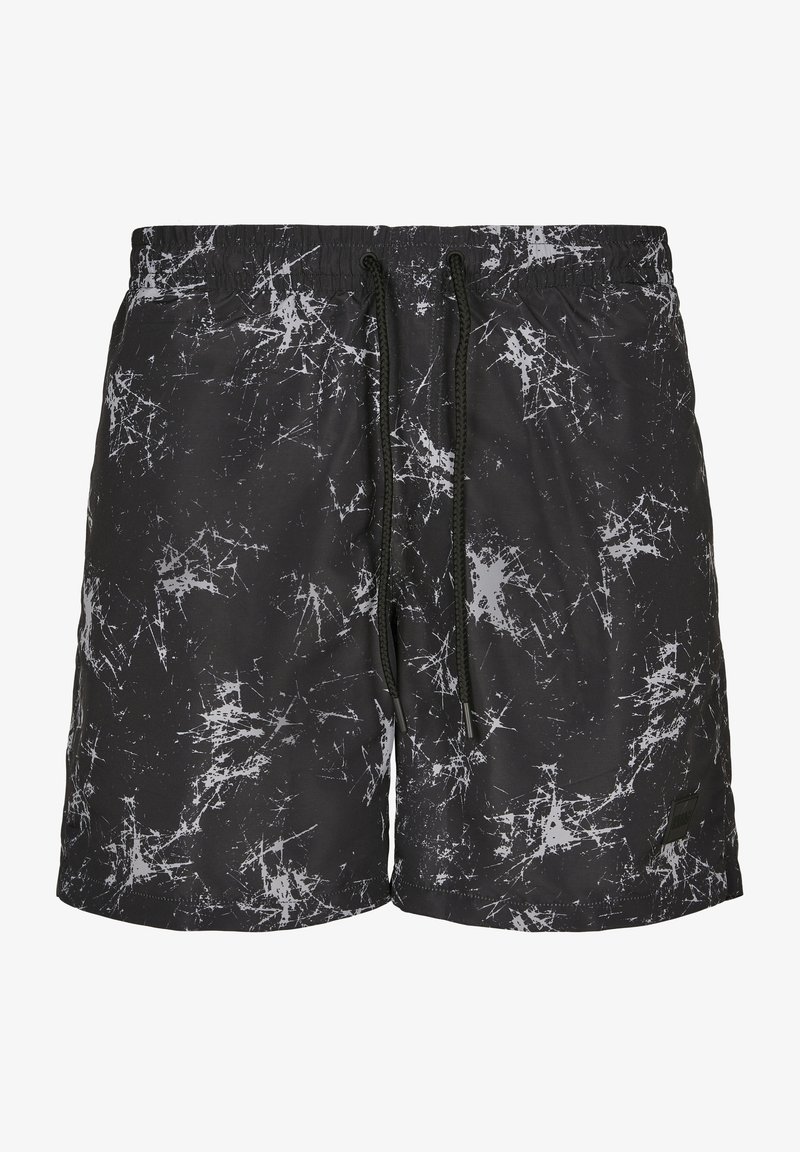 Shorts de bain pour homme, noirs avec un motif éclaboussé blanc, dotés d'une taille élastique et d'un cordon de serrage ajustable. Tissu léger.