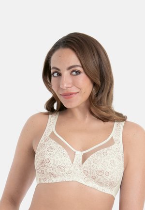 Beiger BH mit Blumenmuster, transparenten Mesh-Akzenten, breiten Trägern und V-förmigem Ausschnitt. Glatte Textur mit dezentem Glanz.