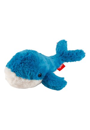 Blue plush whale featuring soft fur, a white underside, small round eyes, and flippers, with a red tag visible on its side.