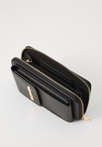 Love Moschino SIGNATURE - Phone pouch - nero