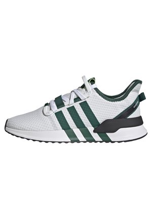 Hvid og grøn atletisk sneaker med mesh-overdel, tre mørkegrønne striber, hvide snørebånd og sort-hvid sål.