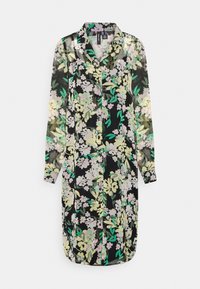 Vestido camisetão floral com fundo preto, apresentando flores em verde claro e rosa, mangas longas e gola. O tecido é semi-transparente.