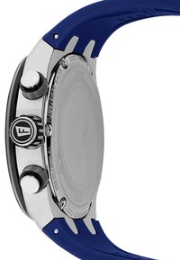 Montre en acier inoxydable argenté avec un bracelet en silicone bleu. Comprend deux boutons argentés et un logo sur le couronne, dos de boîtier lisse.