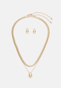 Atlasīts, gold-coloured