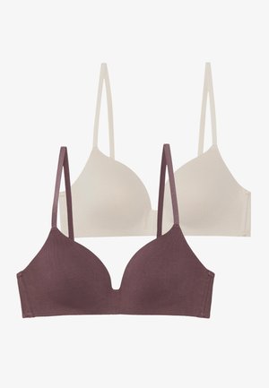 Twee draadloze bh's gestapeld, een in lichtbeige en een in donkerpaars. Beide hebben verstelbare dunne bandjes en een gladde, rekbare stof.