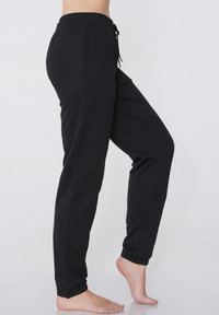 Tezenis MIT PASPELTASCHEN UND TUNNELZUG - Pantalon de survêtement - nero