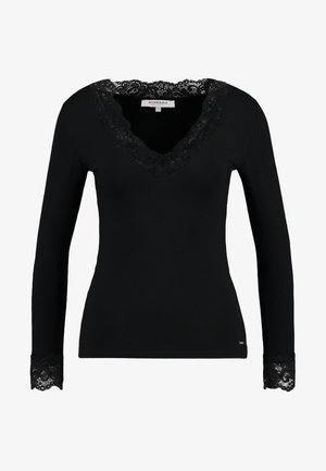 Black long-sleeve top with a V-neckline, featuring a lace trim at the collar and cuffs. Soft fabric with a fitted silhouette.