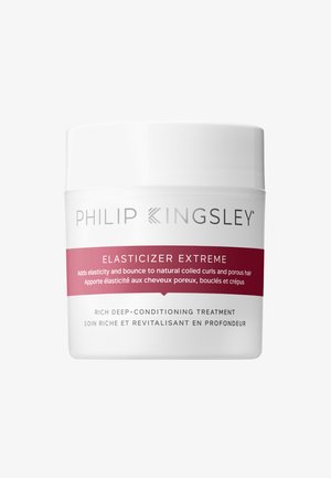 Philip Kingsley Elasticizer Extreme in un contenitore bianco con un'etichetta rosa. Presenta un testo che afferma essere un trattamento nutriente profondo ricco.