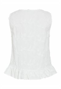 Haut blanc sans bretelles avec broderie florale et ourlet à volants, confectionné dans un tissu léger.