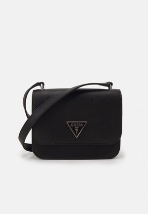 Black textured crossbody bag with front flap and triangular Guess USA logo plaque, featuring an adjustable shoulder strap.