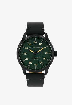 Black leather strap watch with dark green dial, gold hands, numeric minute markers, and water resistant 5 ATM inscription.