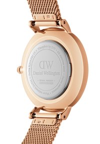 Rose gold stainless steel watch with mesh band. Back view shows polished silver bezel and engraved logo. Water resistant to 30 meters.