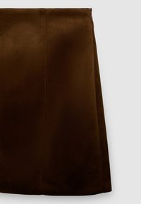 Brown suede mini skirt with a smooth texture, featuring a straight cut, a concealed zipper, and clean lines, suitable for versatile styling.