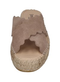 Light brown suede slide sandals with wavy upper design, jute rope sole, and raw edge detailing. Open toe and flat silhouette.