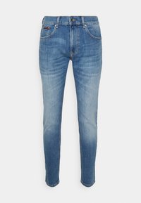 Ljusblå denimjeans med slim fit, fem fickor och kontrasterande sömmar. Har en knapp- och dragkedjestängning, med märkessdetaljer.