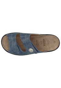 Blue sandal with cut-out design, textured upper, and decorative hardware. Soft beige insole with branding. Black rubber sole for grip.