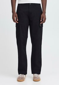 Black cargo pants made of sturdy fabric, featuring side pockets, a straight leg design, and a button closure at the waistband.