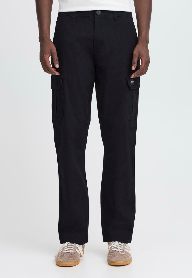 Black cargo pants made of sturdy fabric, featuring side pockets, a straight leg design, and a button closure at the waistband.